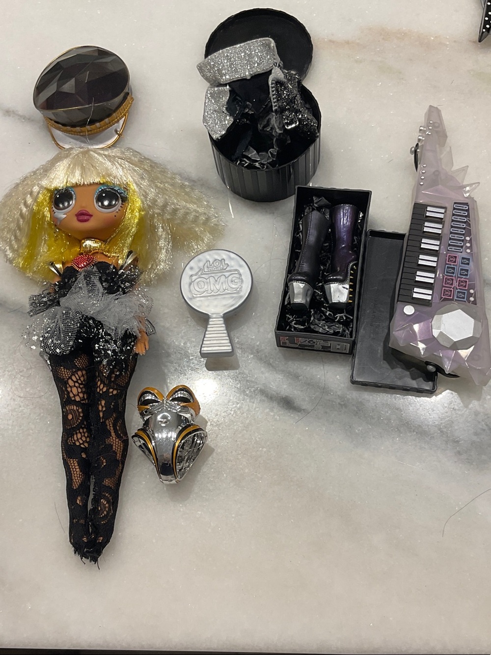 L.O.L. Surprise! Doll with Blonde Hair, Black & Silver Outfit and Purple Guitar